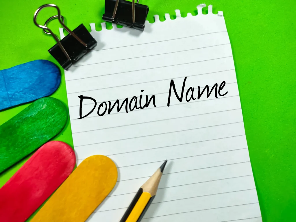 business concept text domain name writing on notep